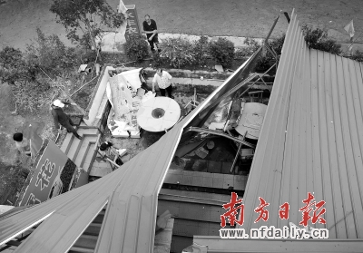 從化良口鎮高沙村一家餐館人員正在收拾殘局。 從化良口鎮高沙村一家餐館人員正在收拾殘局。